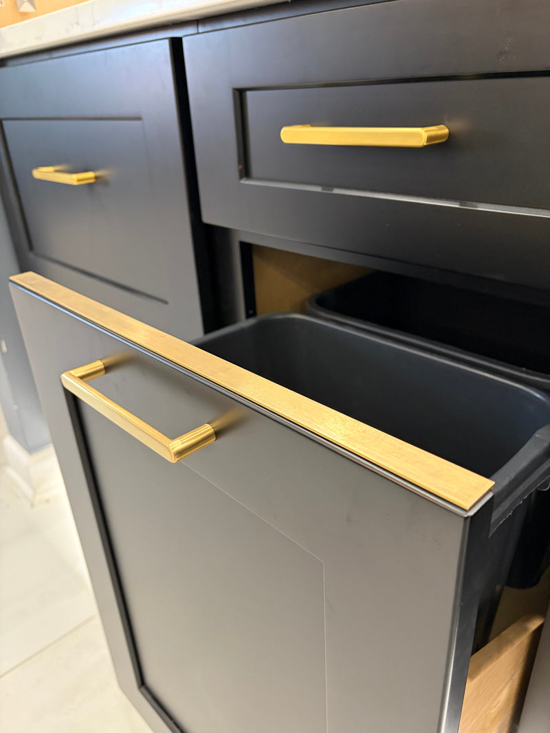 Gold metal trim on cabinets